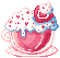 a pink teacup filled with strawberries and cream